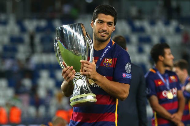 Luis Suarez with trophies